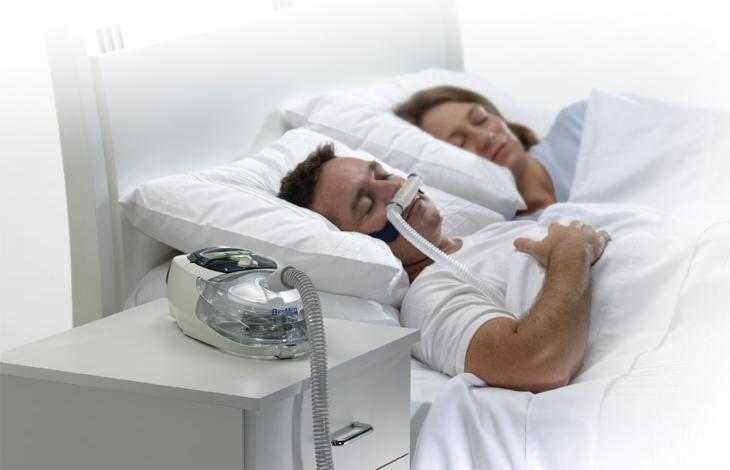 patient sleeping with sleep apnea appliance aid recommended by Dental Care Glebe Sydney Dentist, Dr Maurie Coorey, DDS.