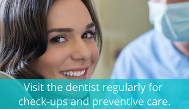 young woman on the dentist chair looking happy to the camera