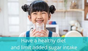 happy little asian girl drinking milk