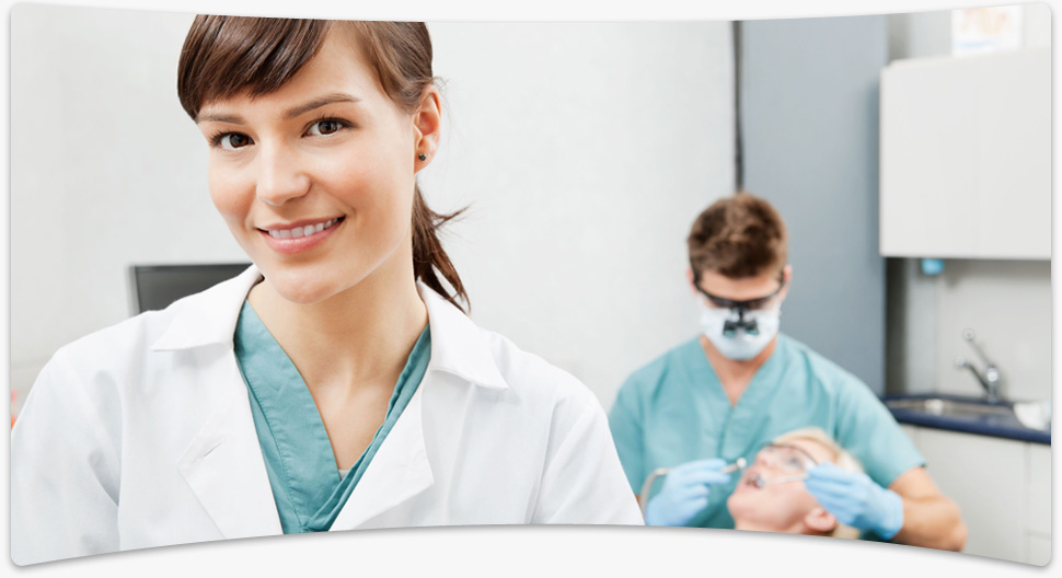 Sydney dentists at work plalcing a dental crown on patient's front tooth.