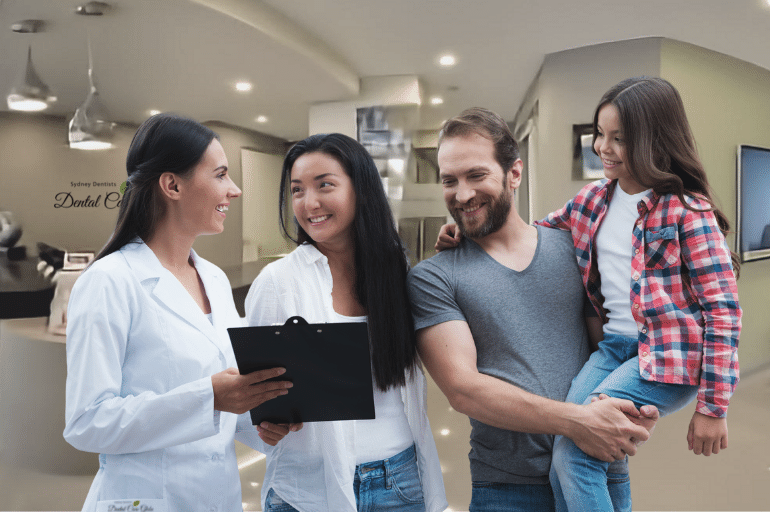Family first consultation at Dental Care Glebe Sydney dentists clinic reception getting the new patient package promotion