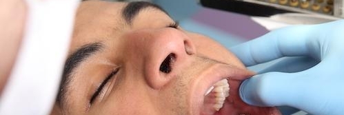 man getting a tooth extraction in booragoon 