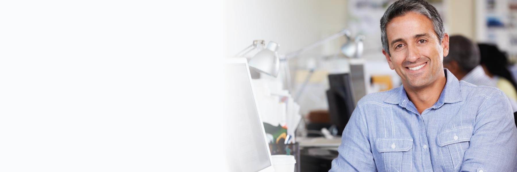 man smiling in office